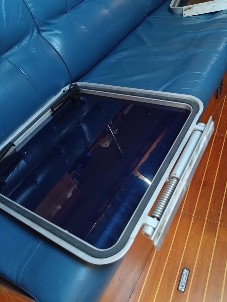Newly refurbished hatch lid sat on blue sofa